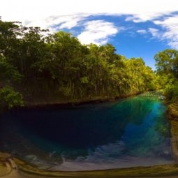 Hinatuan Enchanted River with blue sky panorama